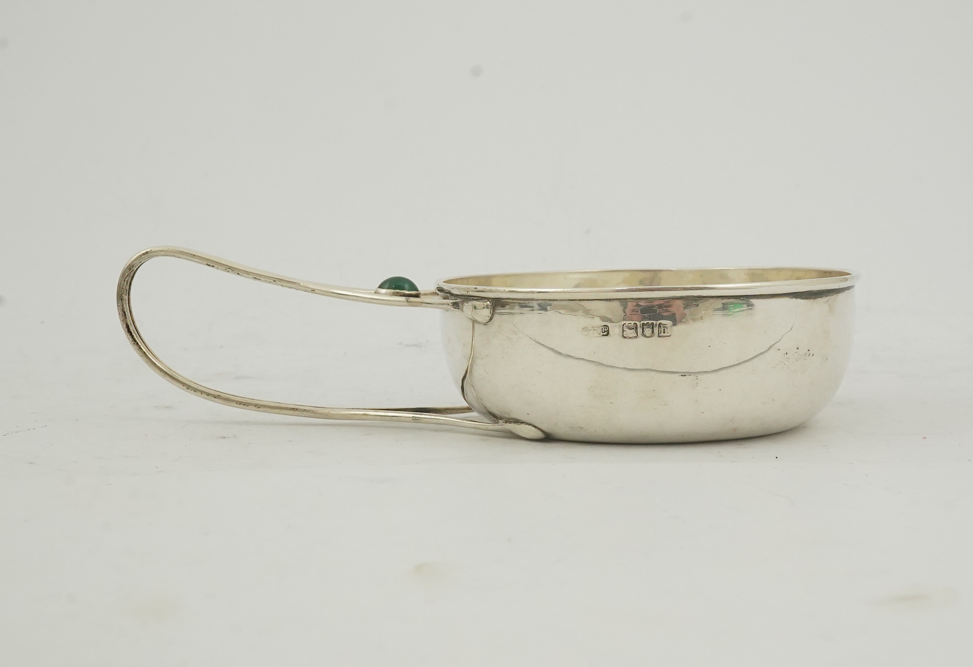 An Edwardian Arts & Crafts Charles Robert Ashbee for the Guild of Handicrafts Ltd silver and single stone cabochon chrysoprase set porringer